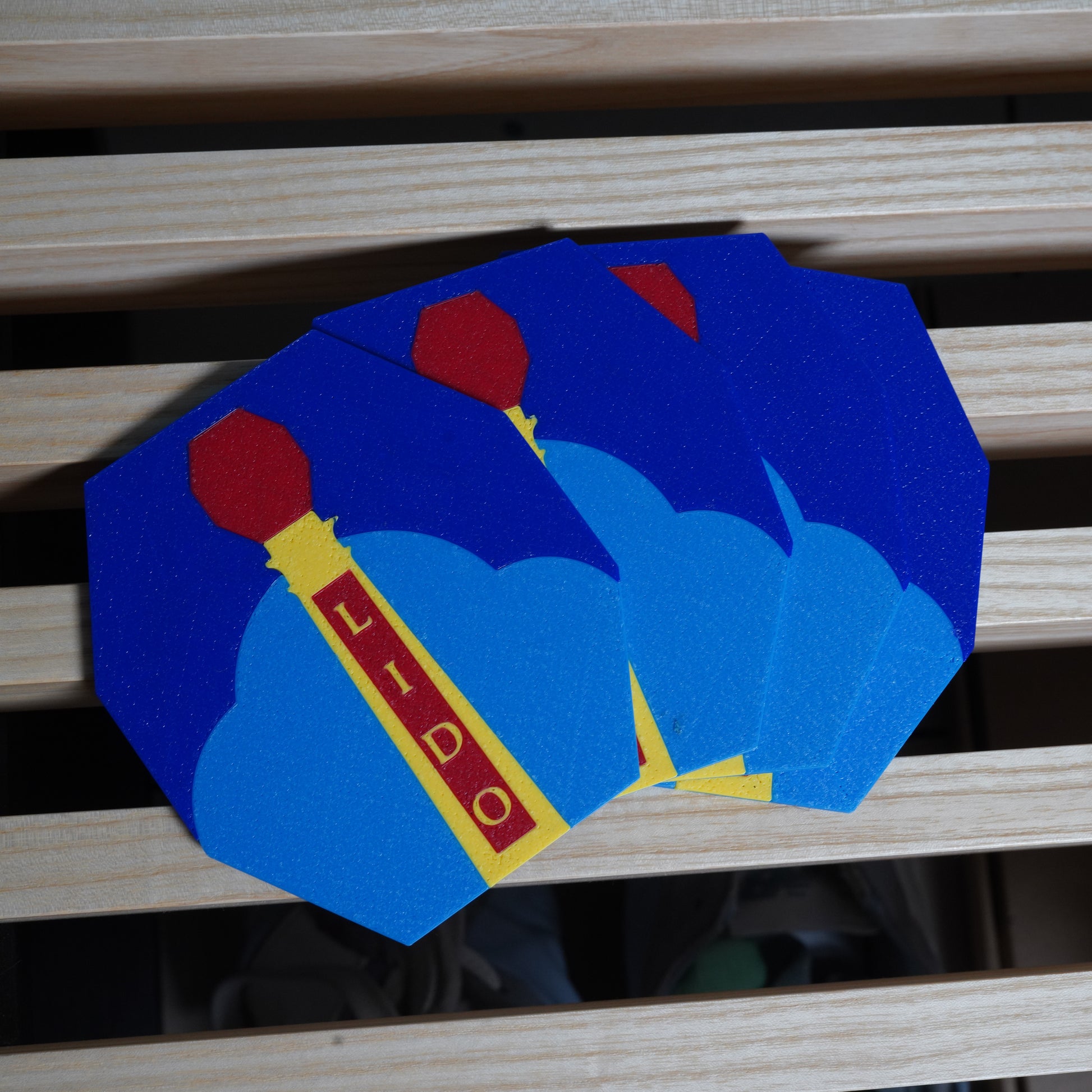 Coasters with red and yellow design showing the Margate Lido sign